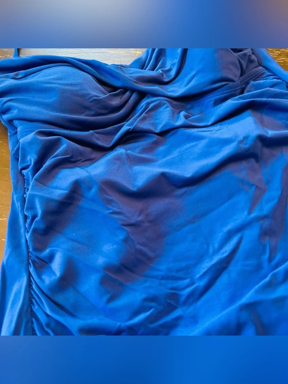 Beautiful blue one piece swimsuit.  Size 10. Very classy and cute!